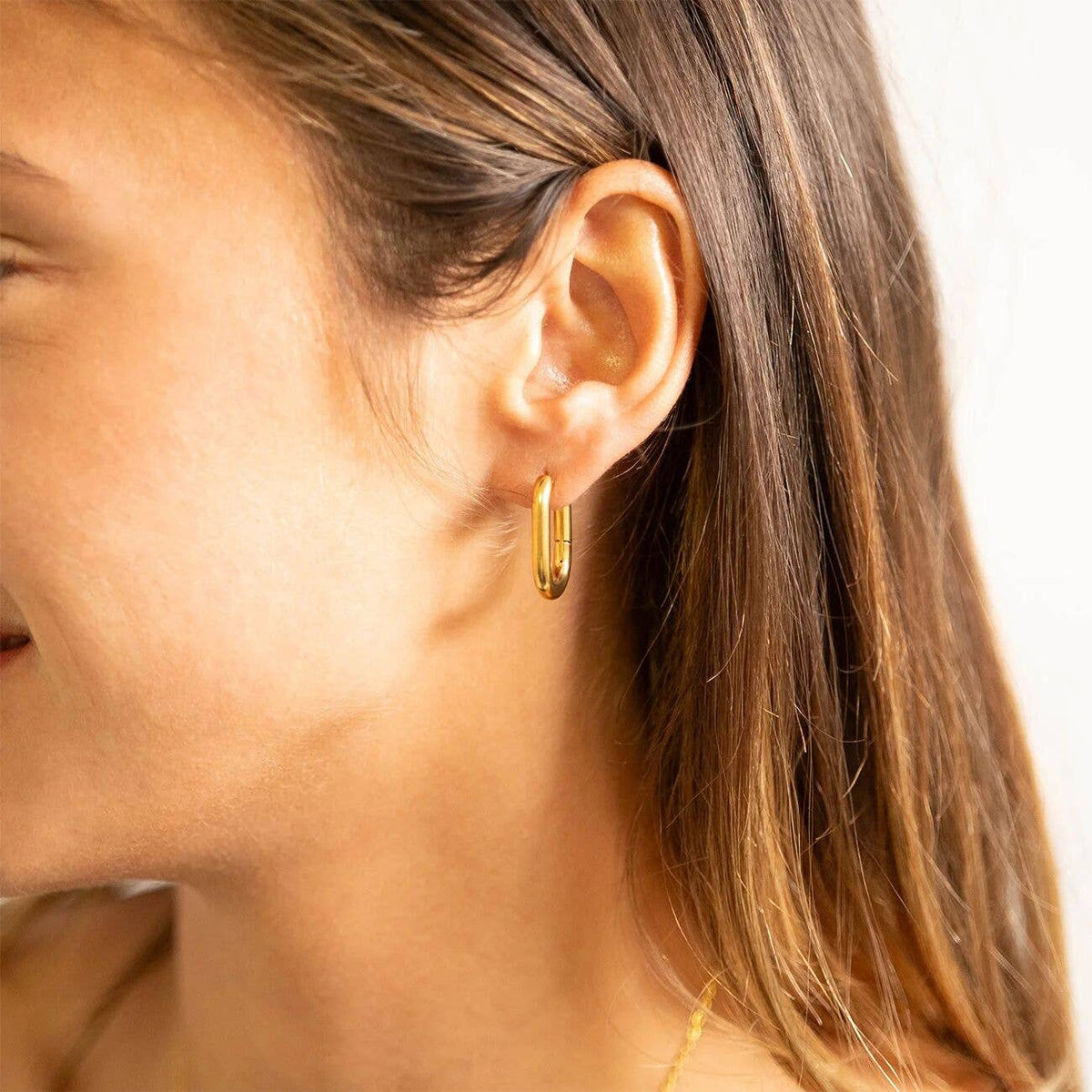 Gold Oval Huggie Earrings