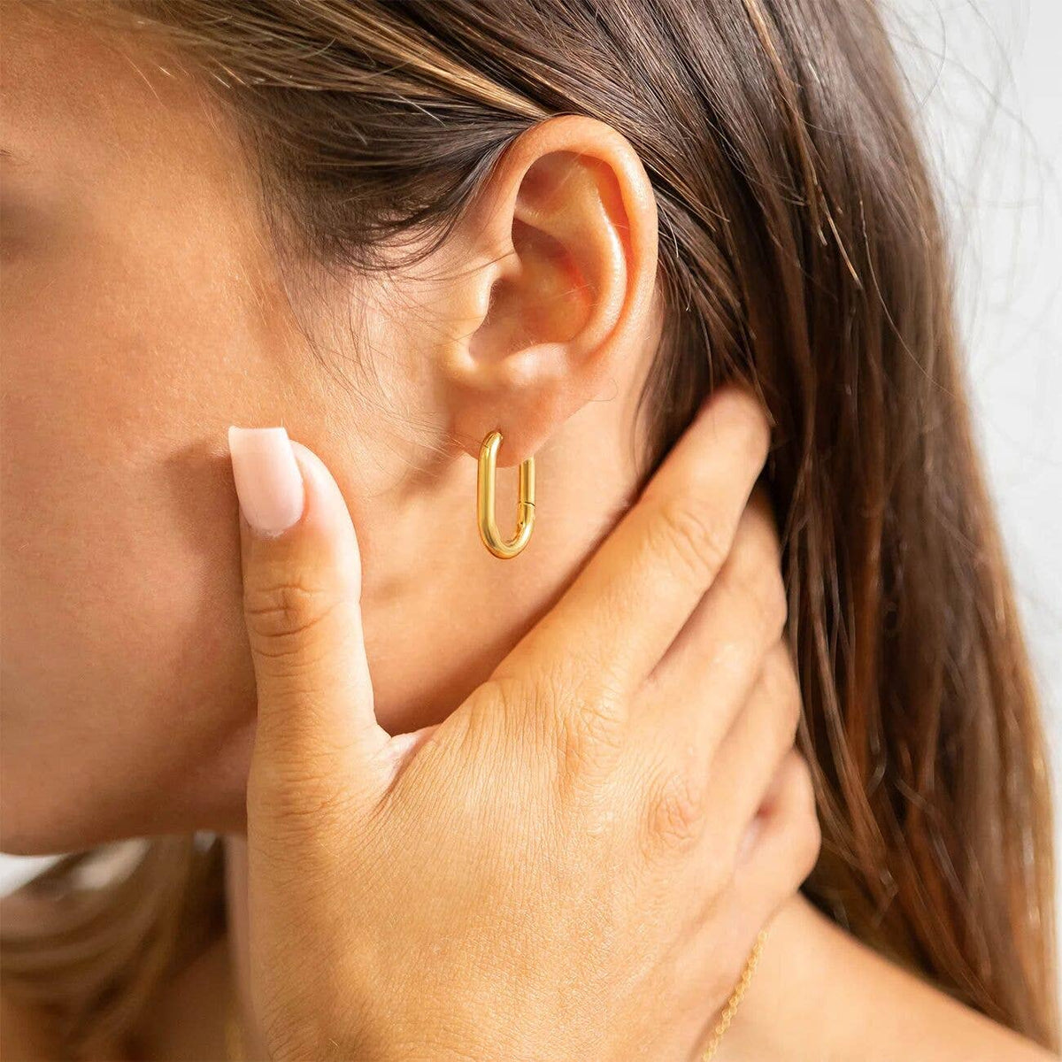 Gold Oval Huggie Earrings